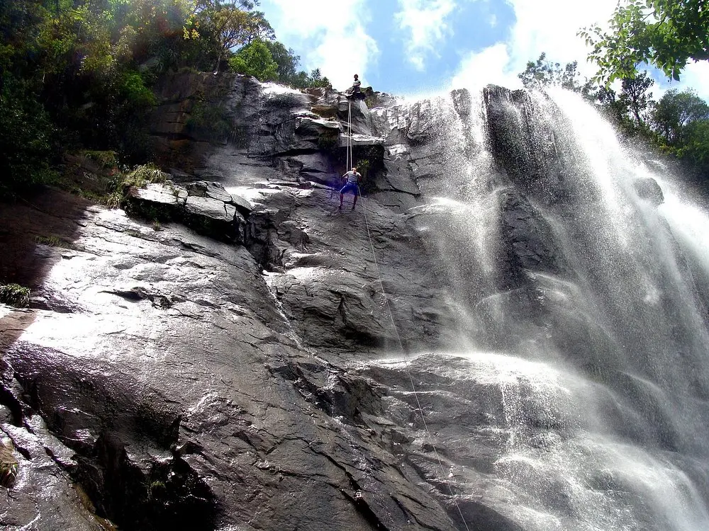 A guided abseil alongside Madonna and Child Waterfall