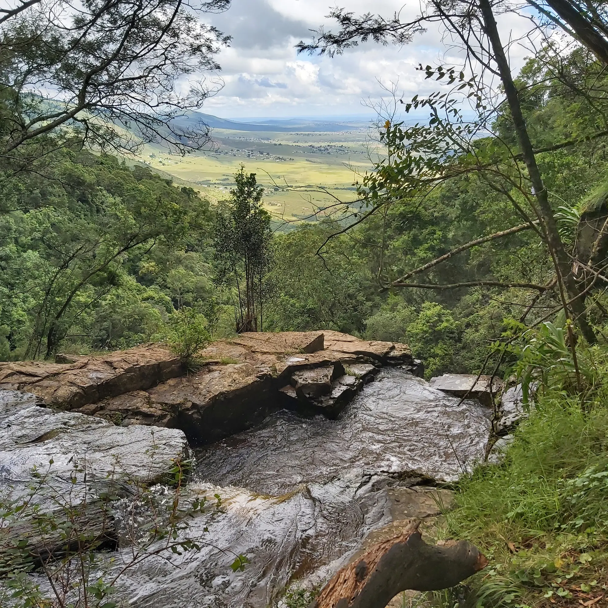 Swallowtail Falls and surrounding mountain landscape